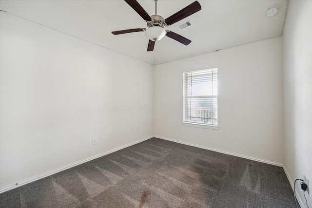 8931 Beacon Mill Dr, Cypress, TX 77433 - unfurnished room with dark carpet, a ceiling fan, a smoke detector, and baseboards