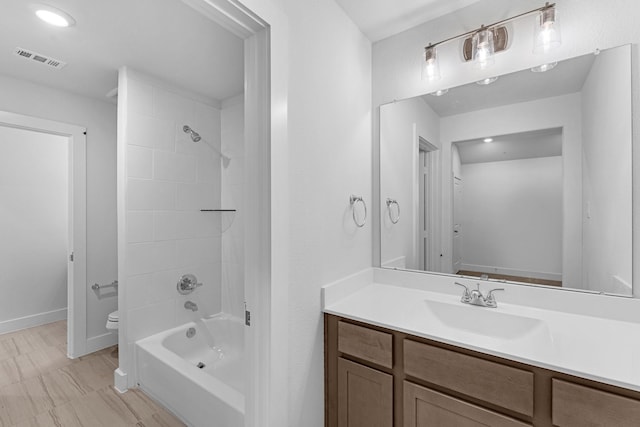 19209 Olive Heath Ln, Magnolia, TX 77355 - bathroom featuring vanity, tub / shower combination, toilet, and baseboards
