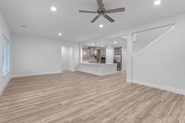 19209 Olive Heath Ln, Magnolia, TX 77355 - unfurnished living room with recessed lighting, baseboards, light wood-type flooring, and a ceiling fan