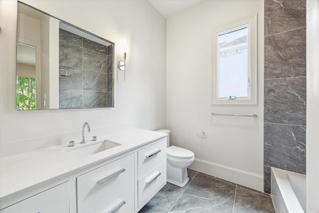 2013 Persa St, Houston, TX 77019 - bathroom with vanity, a bath, toilet, baseboards, and marble finish floors