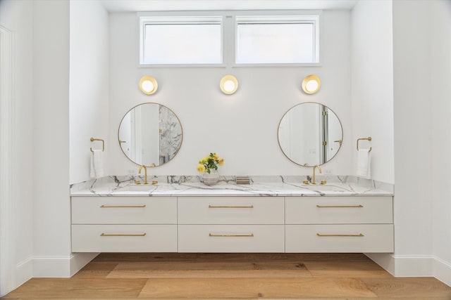 2013 Persa St, Houston, TX 77019 - full bath with double vanity, wood finished floors, and baseboards
