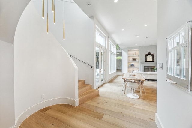 2013 Persa St, Houston, TX 77019 - entryway with wood finished floors, stairs, recessed lighting, a fireplace, and baseboards
