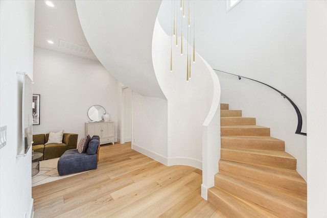 2013 Persa St, Houston, TX 77019 - stairway with wood finished floors and recessed lighting
