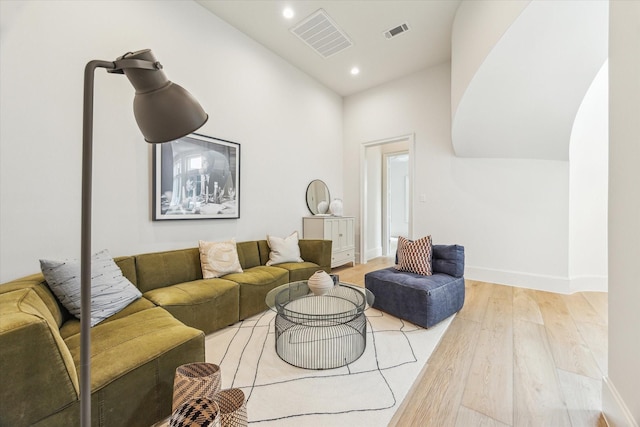 2013 Persa St, Houston, TX 77019 - living room with light wood finished floors, recessed lighting, and baseboards