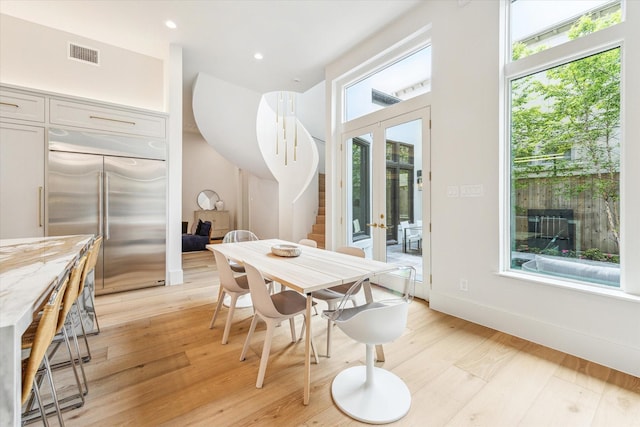 2013 Persa St, Houston, TX 77019 - dining room featuring french doors, light wood-style floors, and recessed lighting