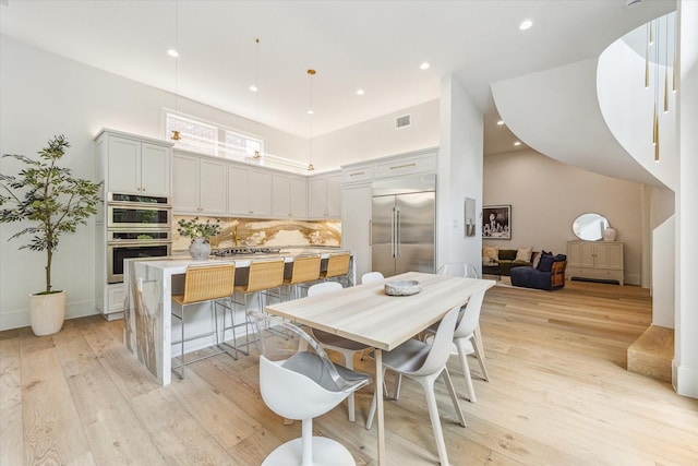 2013 Persa St, Houston, TX 77019 - dining space featuring light wood-type flooring and recessed lighting