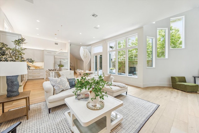 2013 Persa St, Houston, TX 77019 - living area with light wood-type flooring, recessed lighting, and baseboards