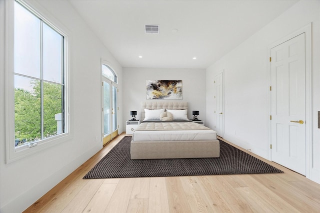2013 Persa St, Houston, TX 77019 - bedroom with multiple windows, wood finished floors, recessed lighting, and baseboards