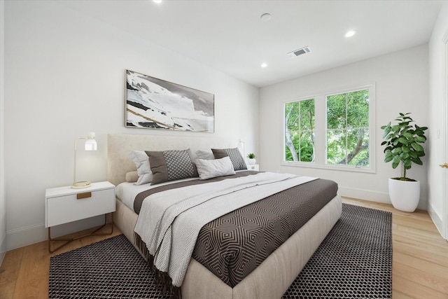 2013 Persa St, Houston, TX 77019 - bedroom featuring baseboards, wood finished floors, and recessed lighting