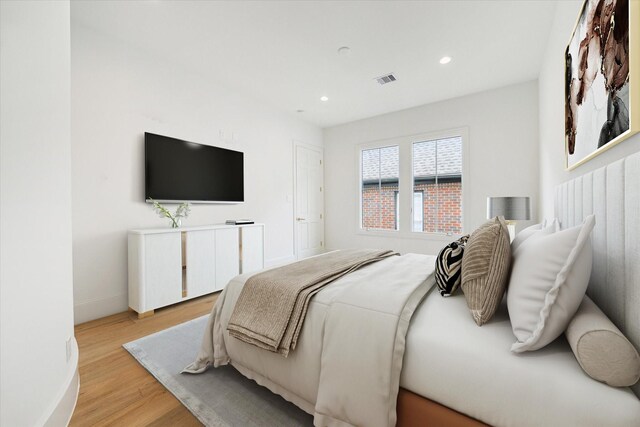2013 Persa St, Houston, TX 77019 - bedroom with light wood-type flooring, baseboards, and recessed lighting