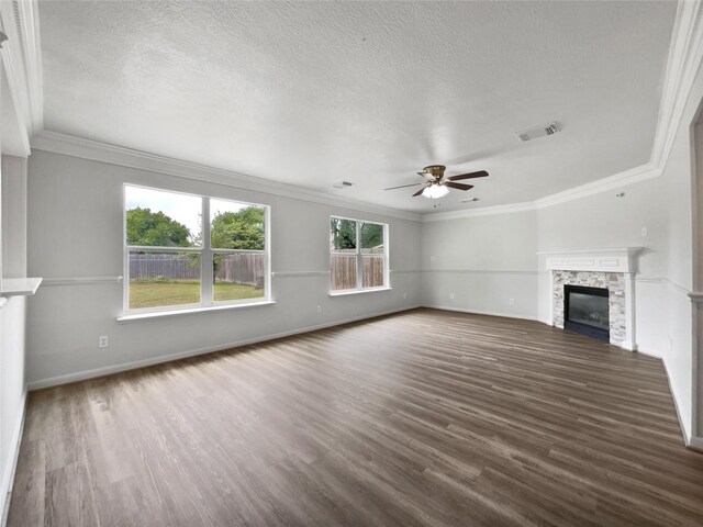 426 N Lindbergh Ct, Baytown, TX 77521 - unfurnished living room featuring ceiling fan, wood finished floors, crown molding, a fireplace, and baseboards