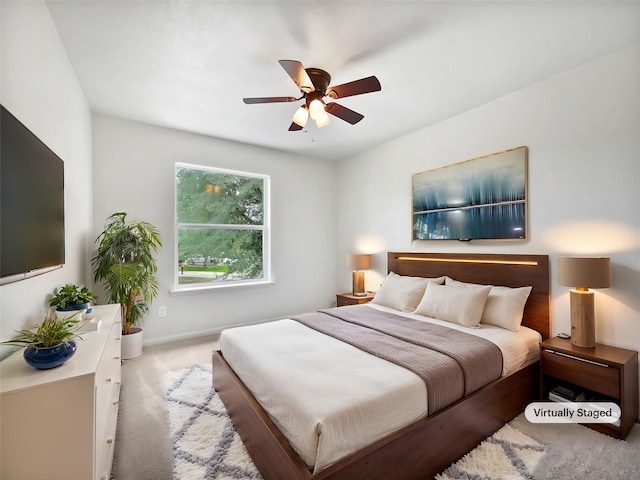 426 N Lindbergh Ct, Baytown, TX 77521 - carpeted bedroom with baseboards and ceiling fan