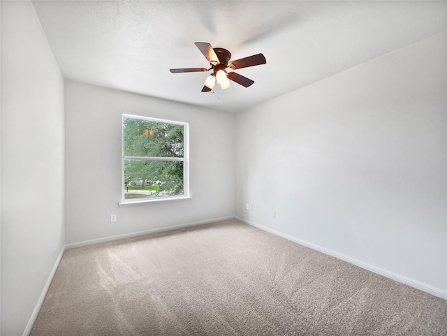 426 N Lindbergh Ct, Baytown, TX 77521 - empty room with carpet floors, baseboards, and a ceiling fan