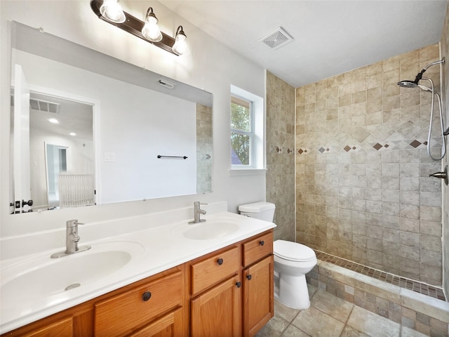 426 N Lindbergh Ct, Baytown, TX 77521 - full bath with toilet, double vanity, and a tile shower