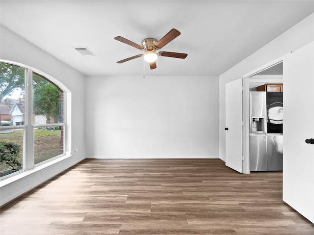 426 N Lindbergh Ct, Baytown, TX 77521 - unfurnished room featuring a ceiling fan and wood finished floors