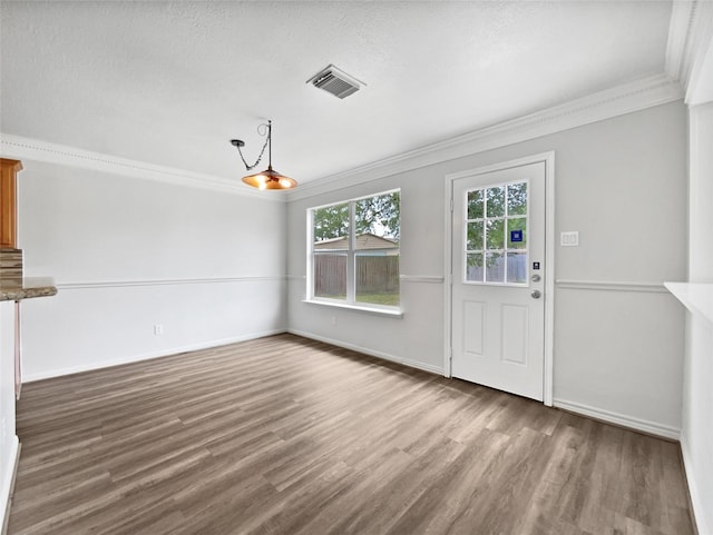 426 N Lindbergh Ct, Baytown, TX 77521 - unfurnished dining area featuring ornamental molding, wood finished floors, and baseboards