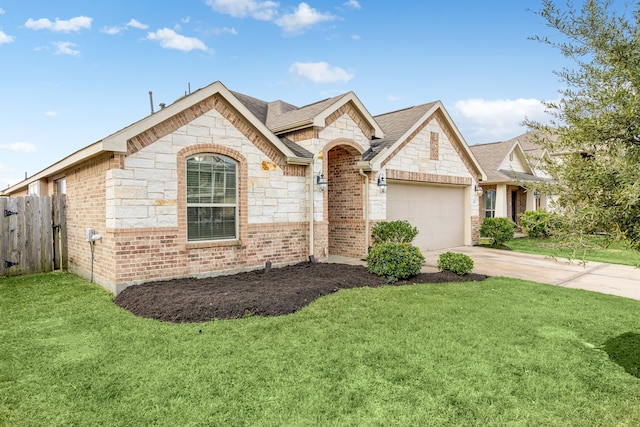 3522 Ember Falls Ln, Katy, TX 77449 - view of front facade with stone siding, driveway, an attached garage, and brick siding