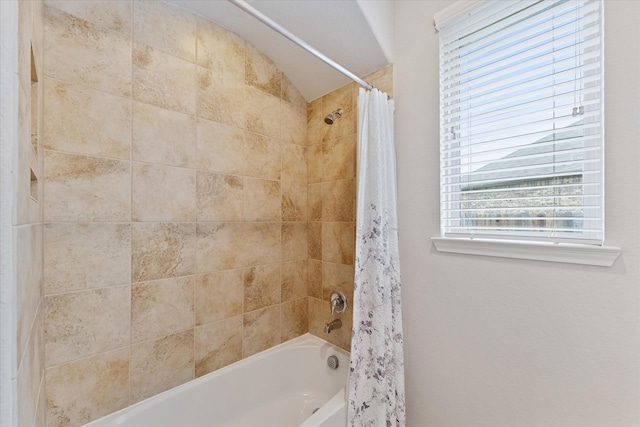 12103 Kaiso Ln, Conroe, TX 77304 - bathroom featuring shower / bath combo with shower curtain