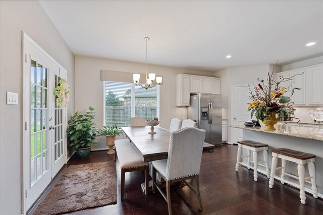 12103 Kaiso Ln, Conroe, TX 77304 - dining area with a chandelier, recessed lighting, and dark wood-style flooring