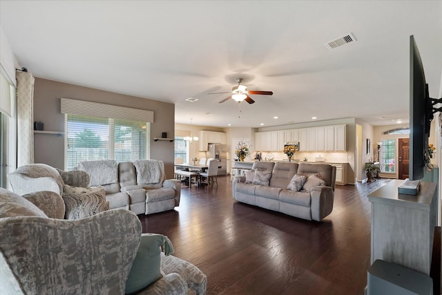 12103 Kaiso Ln, Conroe, TX 77304 - living room featuring plenty of natural light, a ceiling fan, dark wood finished floors, and recessed lighting