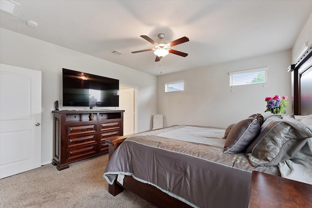 12103 Kaiso Ln, Conroe, TX 77304 - bedroom with light carpet and ceiling fan