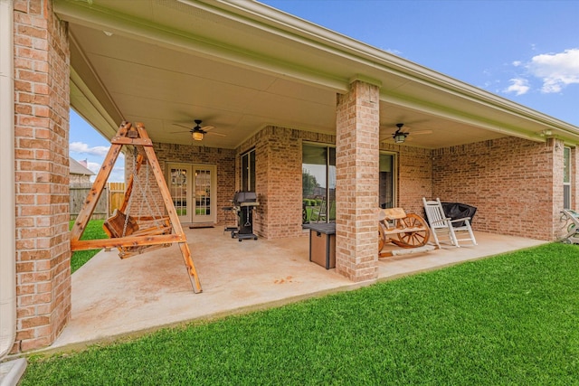12103 Kaiso Ln, Conroe, TX 77304 - view of patio / terrace featuring a ceiling fan and french doors