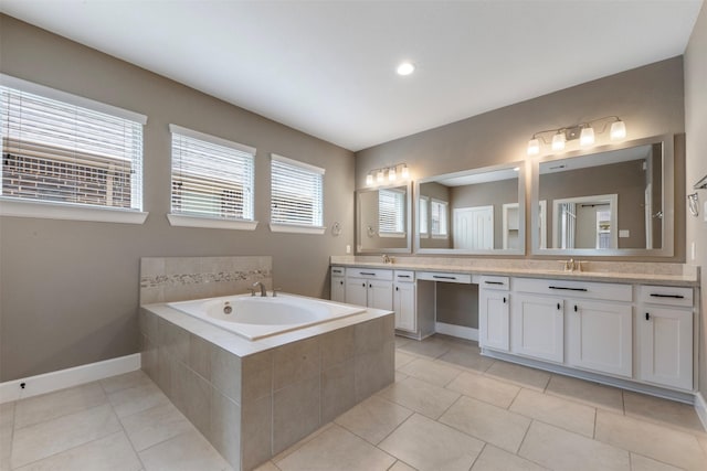 15002 House Martin Ln, Cypress, TX 77429 - bathroom with double vanity, a garden tub, tile patterned flooring, and baseboards
