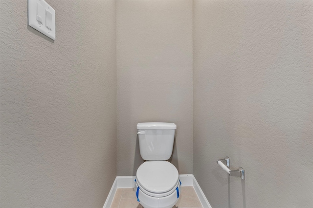 15002 House Martin Ln, Cypress, TX 77429 - bathroom featuring toilet, tile patterned flooring, and baseboards