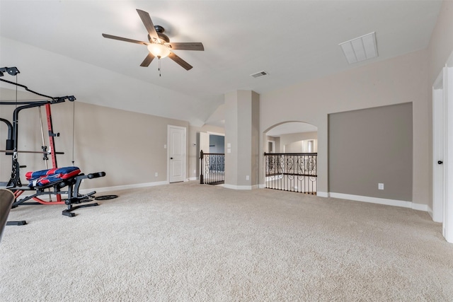 15002 House Martin Ln, Cypress, TX 77429 - exercise room featuring ceiling fan, carpet flooring, lofted ceiling, baseboards, and arched walkways