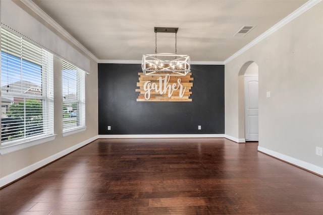 15002 House Martin Ln, Cypress, TX 77429 - spare room featuring a chandelier, hardwood / wood-style flooring, arched walkways, crown molding, and baseboards