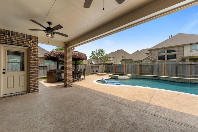 15002 House Martin Ln, Cypress, TX 77429 - view of swimming pool featuring ceiling fan, a fenced backyard, a patio, and a pool with connected hot tub