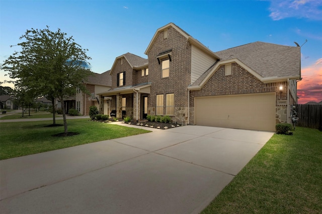 15002 House Martin Ln, Cypress, TX 77429 - traditional-style house featuring a garage, driveway, brick siding, and roof with shingles