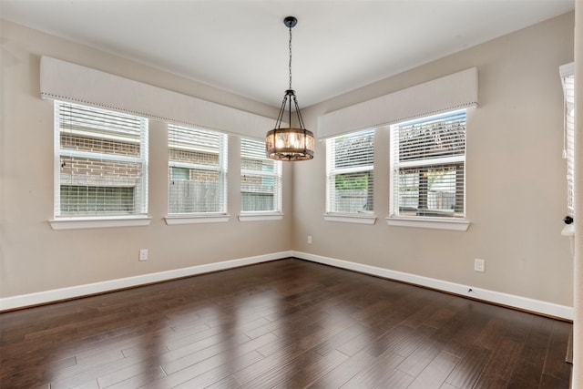 15002 House Martin Ln, Cypress, TX 77429 - spare room with a chandelier, baseboards, and dark wood-style floors