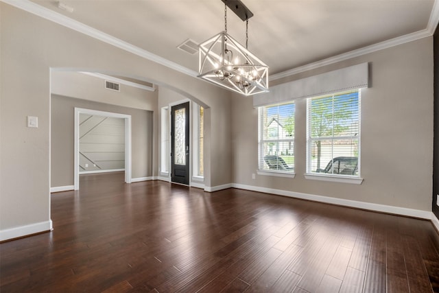 15002 House Martin Ln, Cypress, TX 77429 - unfurnished room with arched walkways, a chandelier, ornamental molding, baseboards, and dark wood-style flooring