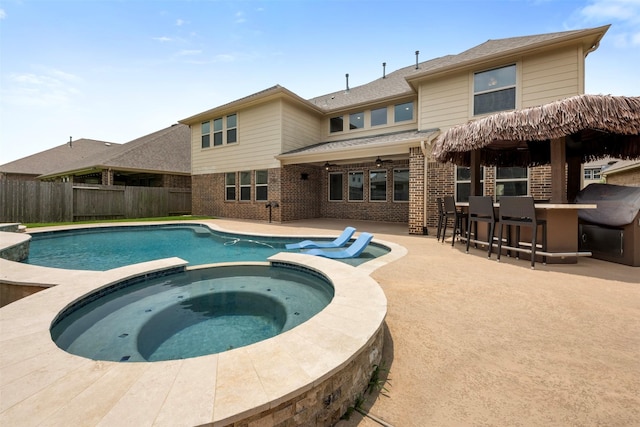 15002 House Martin Ln, Cypress, TX 77429 - view of swimming pool with a fenced backyard, a pool with connected hot tub, a patio, and a ceiling fan