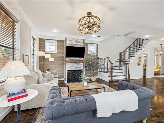 1200 W 24th St, Houston, TX 77008 - living area with a chandelier, stairway, a tile fireplace, ornamental molding, and wood finished floors