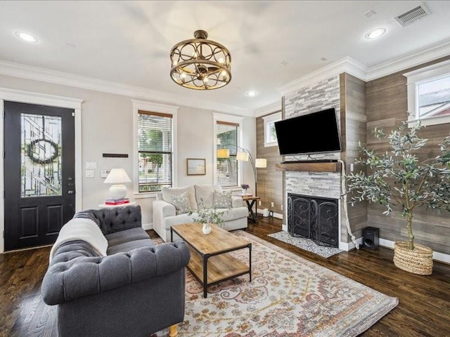1200 W 24th St, Houston, TX 77008 - living area featuring a fireplace with flush hearth, healthy amount of natural light, wood finished floors, recessed lighting, and ornamental molding