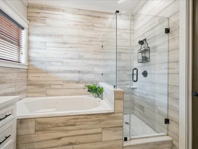 1200 W 24th St, Houston, TX 77008 - bathroom featuring a garden tub, a stall shower, and vanity