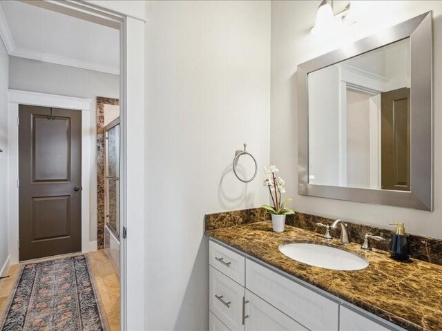 1200 W 24th St, Houston, TX 77008 - full bath with vanity, crown molding, and bath / shower combo with glass door