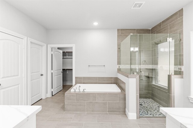 116 Augusta Dr, Huntsville, TX 77340 - bathroom with a shower stall, a bath, tile patterned floors, vanity, and recessed lighting
