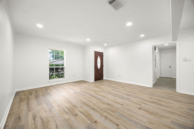 2113 Timber Ln, Conroe, TX 77301 - entrance foyer with recessed lighting, light wood-type flooring, baseboards, and ornamental molding
