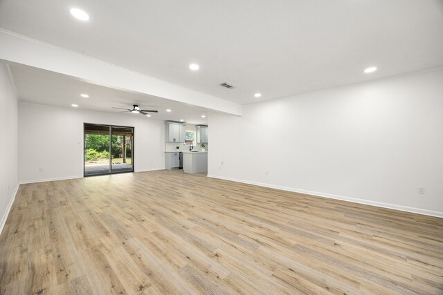 2113 Timber Ln, Conroe, TX 77301 - unfurnished living room with recessed lighting, baseboards, light wood-style flooring, and ceiling fan