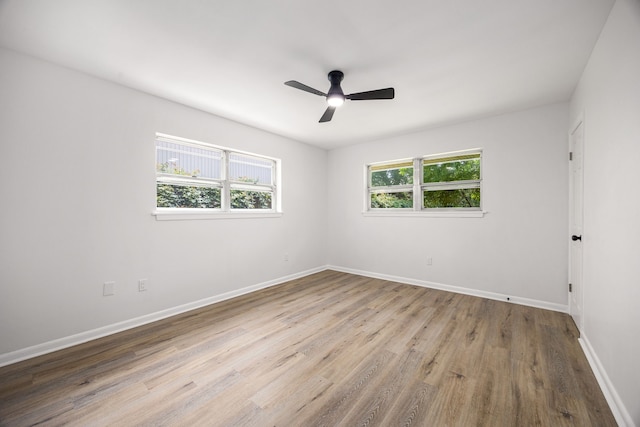 2113 Timber Ln, Conroe, TX 77301 - spare room featuring baseboards, wood finished floors, and ceiling fan
