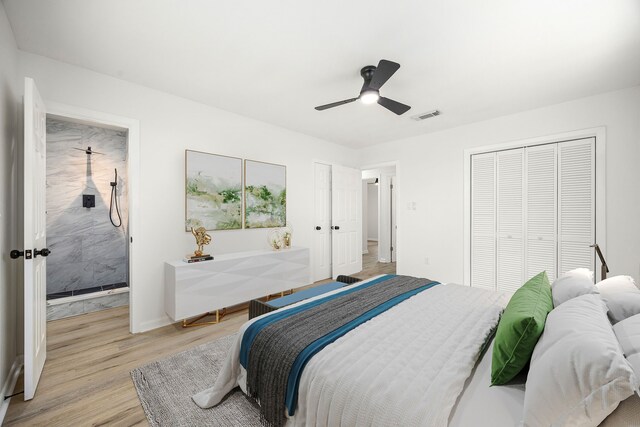 2113 Timber Ln, Conroe, TX 77301 - bedroom featuring light wood finished floors, ceiling fan, and a closet