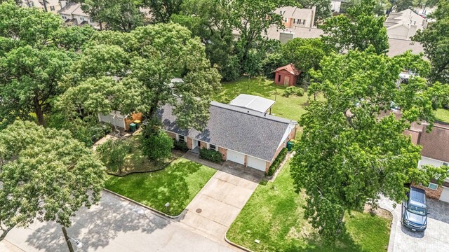 2113 Timber Ln, Conroe, TX 77301 - aerial perspective of suburban area with a tree filled landscape
