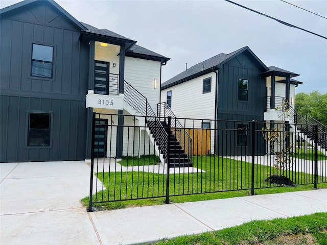 3105 Grassmere St, Houston, TX 77051 - view of front of house featuring stairway and board and batten siding