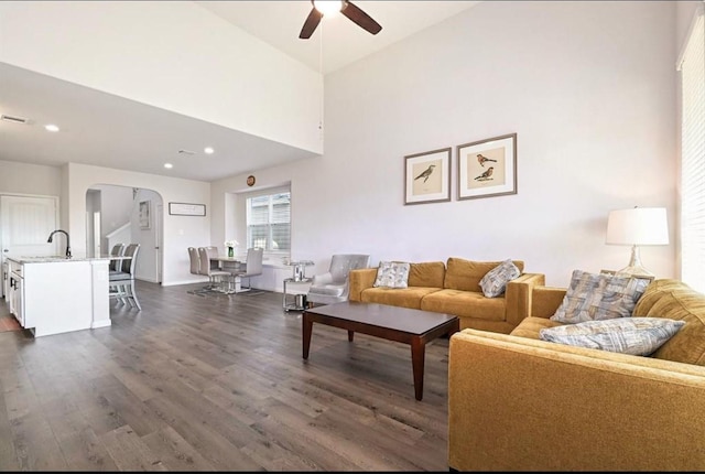 23523 Montague Dr, Spring, TX 77373 - living room featuring arched walkways, ceiling fan, dark wood-style floors, recessed lighting, and baseboards