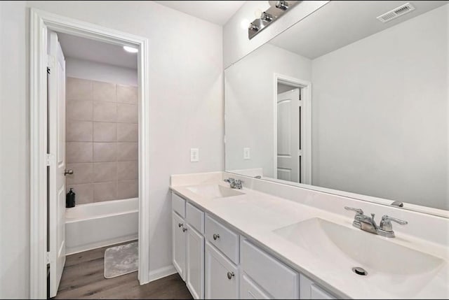 23523 Montague Dr, Spring, TX 77373 - full bath with wood finished floors, double vanity, and baseboards