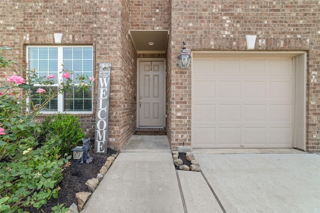 15315 Kinord Run Dr, Humble, TX 77346 - doorway to property with brick siding, a garage, and concrete driveway