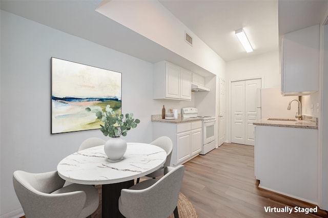 2400 N Braeswood Blvd Unit 106, Houston, TX 77030 - dining room with light wood-style floors